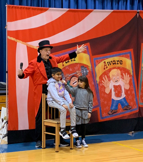 In our popular Diversity Circus elementary school assembly show, we teach  students to be F.A.I.R. and stress important character traits like respect and inclusion.